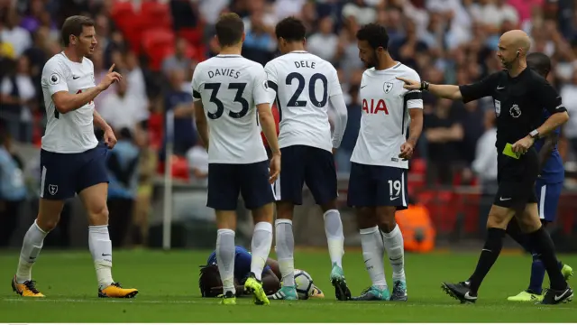 Jan Vertonghen is booked for fouling Victor Moses