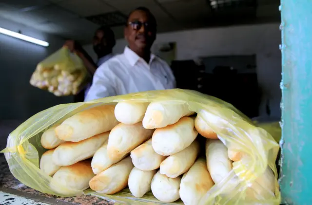 Sudanese vendors wait for customers at a bakery in Khartoum on December 17, 2010.