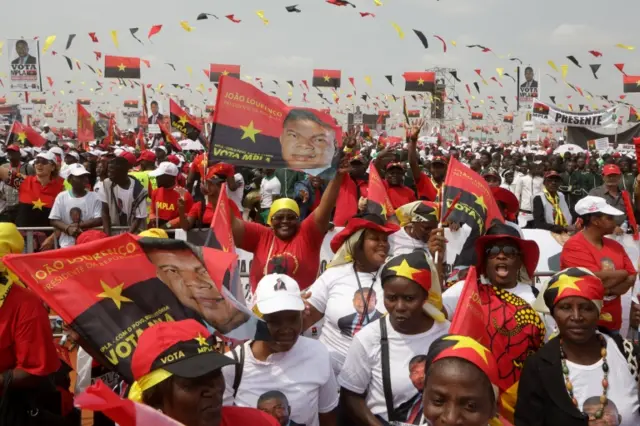 Supporters of Joao Lourenco (unseen), the candidate of the Popular Movement for the Liberation of Angola (MPLA) cheer during his elections campaign rally in Lobito, Angola,