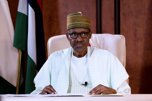 A handout image made available by the State House of Nigerian on August 21, 2017, shows Nigerian President Mohammadu Buhari addressing the nation on state television