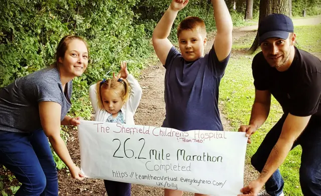 Billy and his family completing his virtual marathon