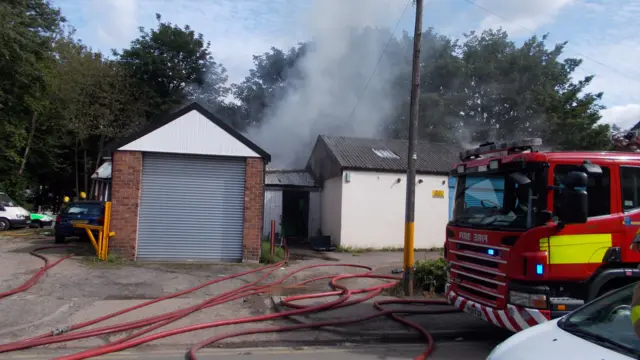 Smoke coming from garage fire site