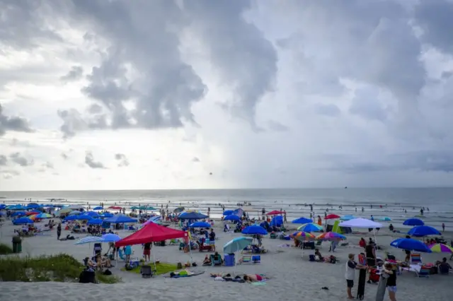 In South Carolina's Isle of Palms beach-goers hope those clouds will dissipate.