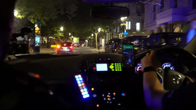 Inside a police car in Birmingham