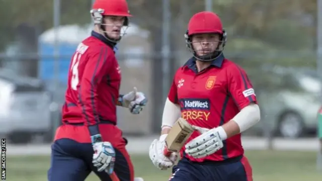 Jersey batsmen complete a run