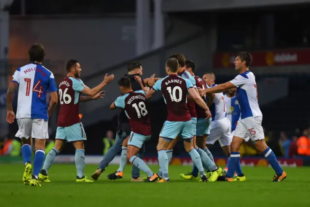 A Blackburn fan is taken down by Ashley Westwood