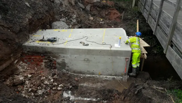 Work to repair the culvert under the road