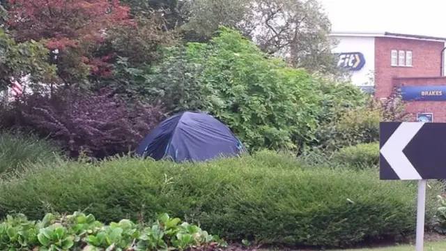 The dark blue tent on Trent Valley island