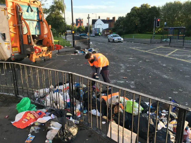 Bin men clearing up the rubbish