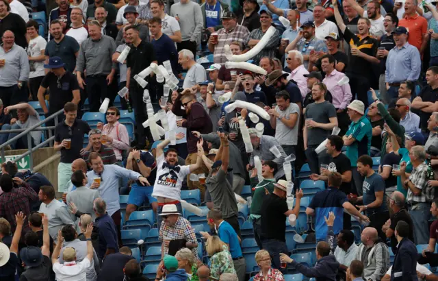 Fans with empty beer cups