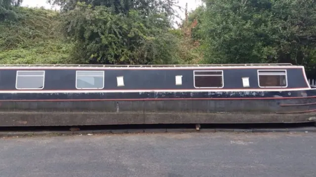 Boat left by the side of a road in Smethwick