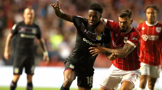 Joshua Onomah of Aston Villa and Marlon Pack of Bristol City in action