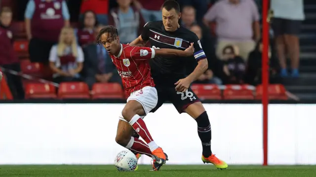 Bobby Reid of Bristol City and John Terry of Aston Villa in action