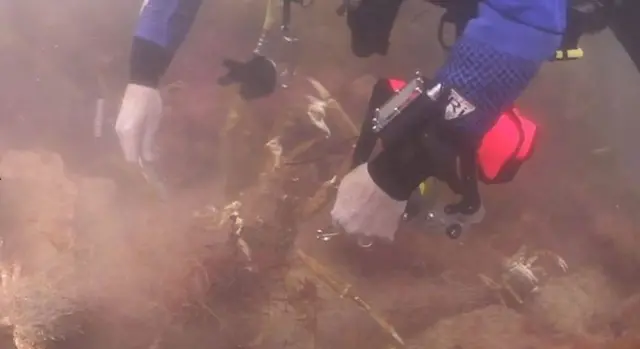 Diver dismantling ghost gear