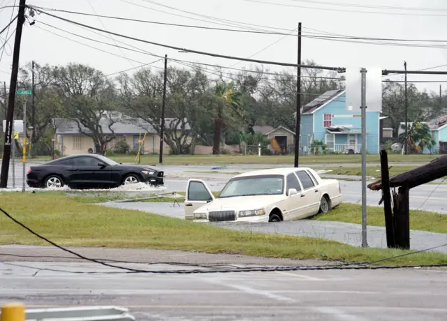 A car caught in floodwater in the aftermath of Hurricane Harvey in Rockport, Texas, 26 August 2017