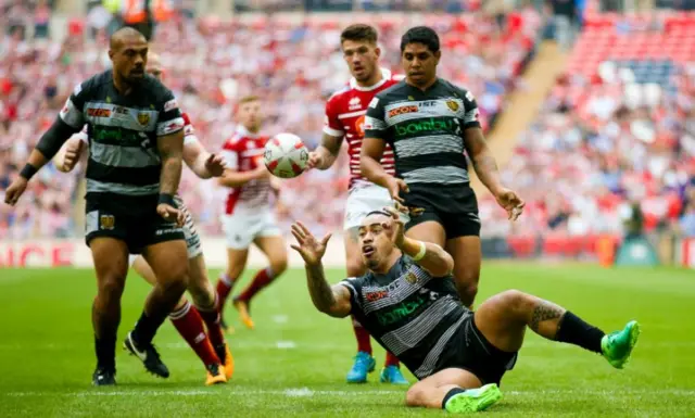 Hull FC right wing Mahe Fonua (2) catches the high ball and lays it off