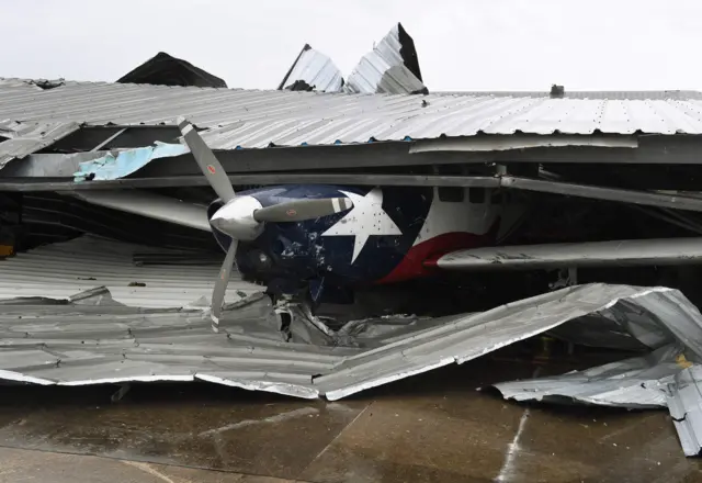 A badly damaged light plane in its hanger at Rockport Airport after heavy damage when Hurricane Harvey hit Rockport, Texas on August 26, 2017.