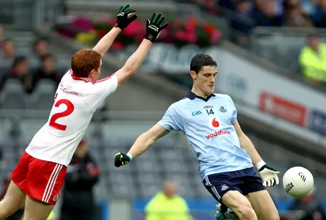 Diarmuid Connolly attempts to get in a shot for Dublin despite Peter Harte's best efforts in the last championship meeting between the counties in 2011