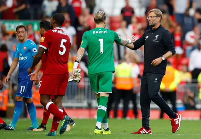 Liverpool manager Juergen Klopp celebrates with Loris Karius after the game