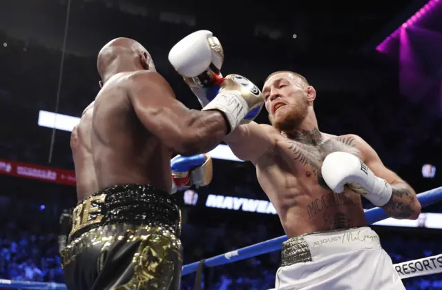 Mayweather in action with McGregor