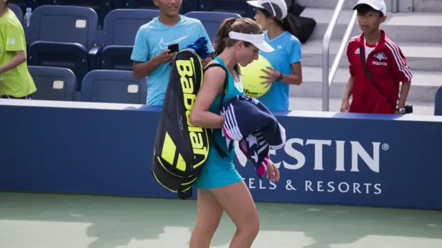 Johanna Konta of Great Britain leaves the court