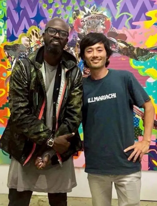 Black Coffee (L) photographed with another DJ