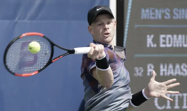 Kyle Edmund of Great Britain hits a return