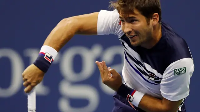 Dusan Lajovic of Serbia serves