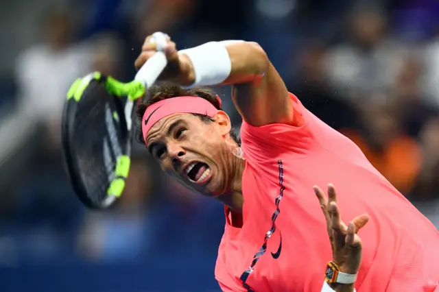 Rafael Nadal serves