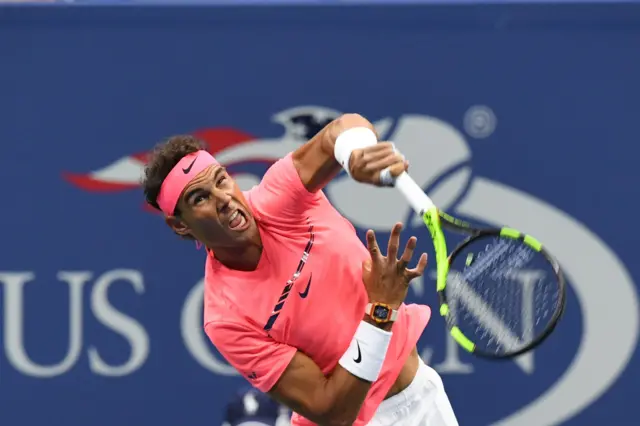 Rafael Nadal serves