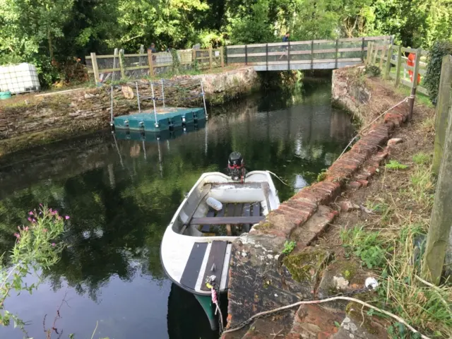 The lock, and river with a small boat