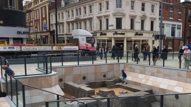 Children playing on the historic Beverley gate ruins.