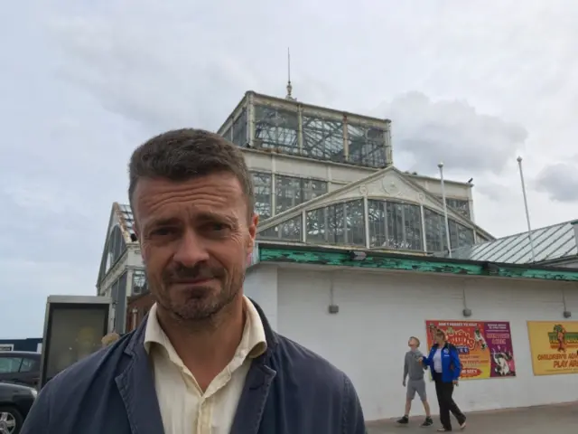 Darren Barker standing in front of the Winter Gardens