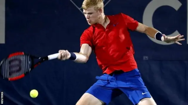 Kyle Edmund hitting a tennis ball.