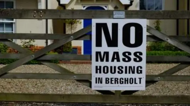 A campaign poster against the housing in East Bergholt