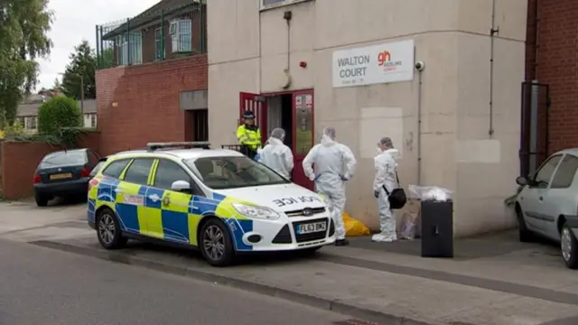 Forensic scene outside a flat