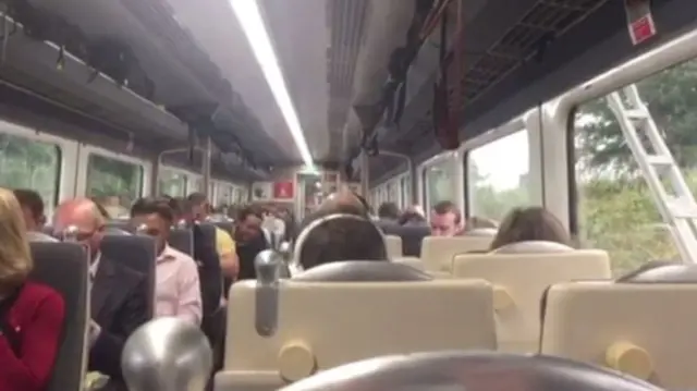 Passengers on broken down train