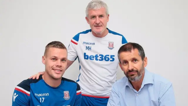 Ryan Shawcross with Stoke City manager Mark Hughes and chief executive Tony Scholes
