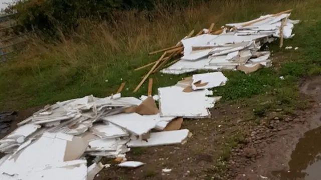 Plasterboard on village lane