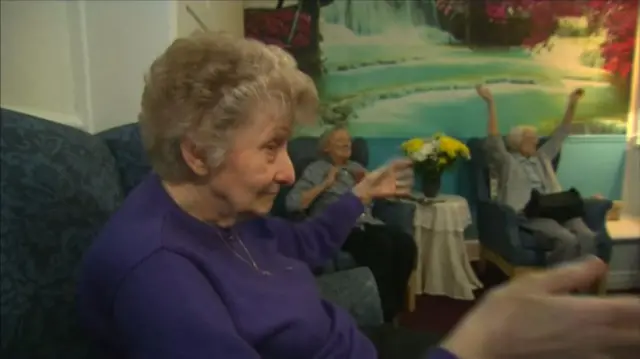 People in a care home taking part in an activity