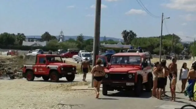 Beach with emergency vehicles