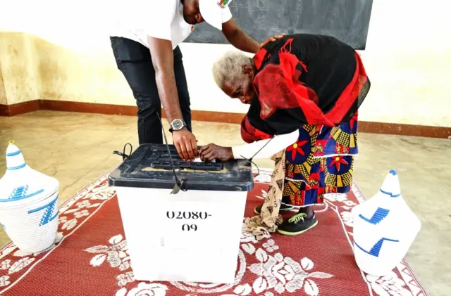 Woman voting in Rwanda