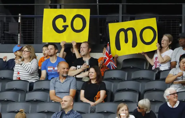 Fans with a Mo Farah sign