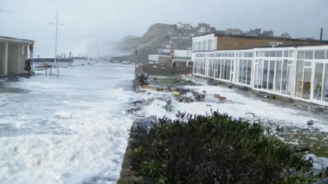 Storm waves breach seawall at West Beach