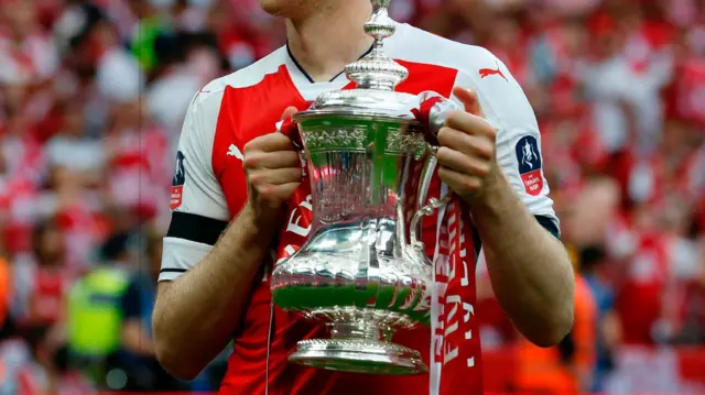 The FA Cup in Per Mertersacker's hands