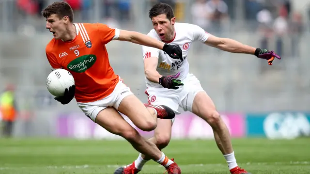 Niall Grimley of Armagh in action against Sean Cavanagh of Tyrone