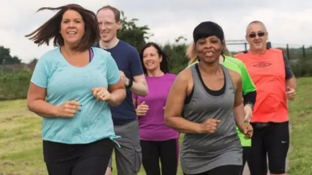 A group taking part in a #RunTogether event