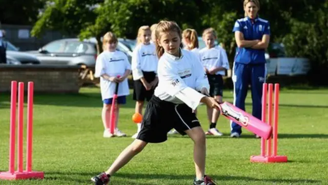 Girls playing cricket