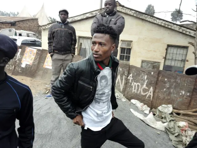 Hip-hop artist Octopizzo is pictured waiting at a polling station