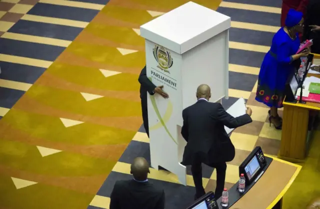 A voting booth is brought into the South African parliament to allow Members of Parliament to vote for or against the motion of no-confidence against South African president, Jacob Zuma (